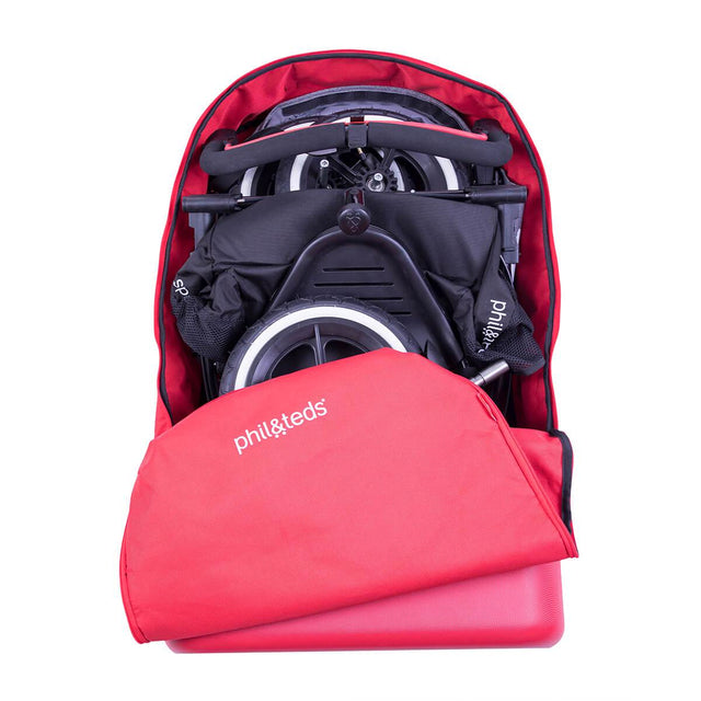 phil&teds travel bag loaded with buggy and zipped open top view_red